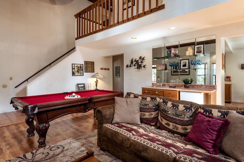living room seating with pool table