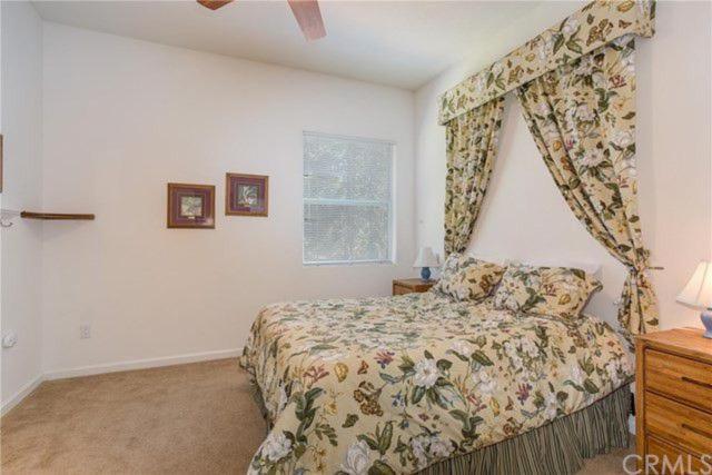 bedroom with queen bed and valance