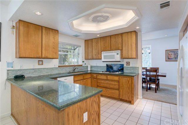 kitchen with wood cabinets and green countertops