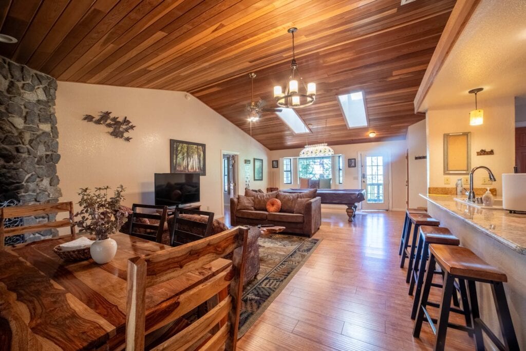 living room with fireplace, seating, and television
