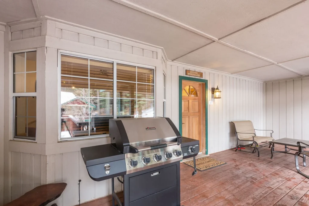 deck with grill and outdoor seating