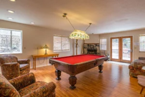 pool table and stone fireplace