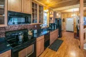 single wall kitchen with wood cabinets