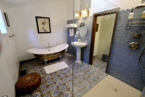 bathroom with tub and walk in shower