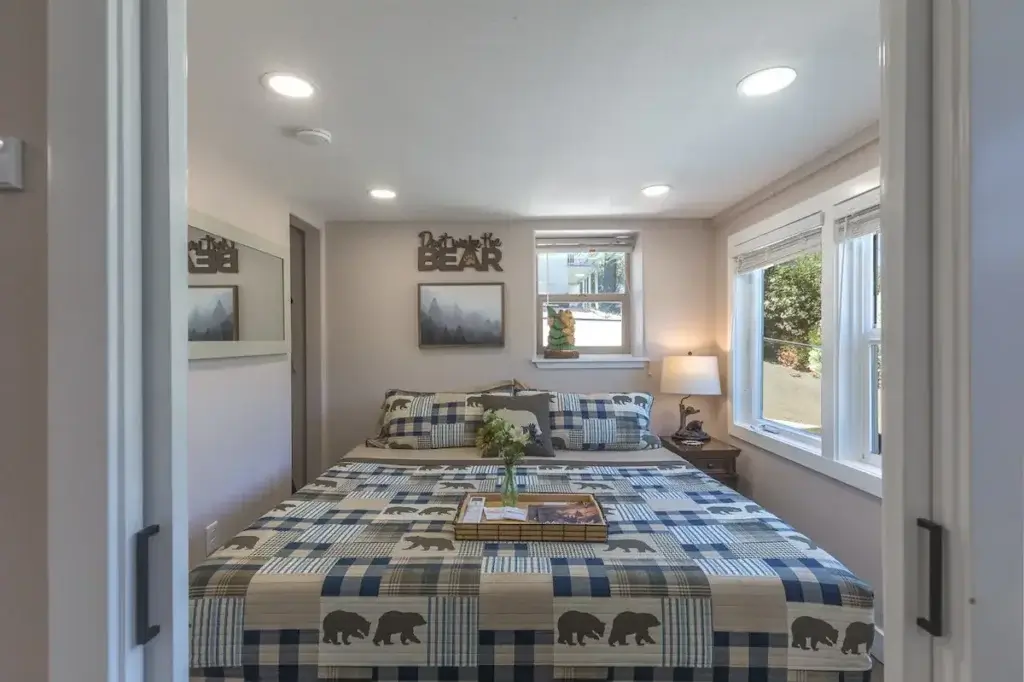 bedroom with large bed and bear bedding