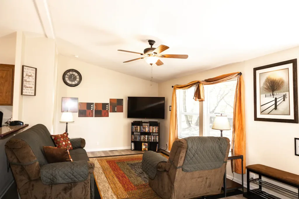 living room with seating and television