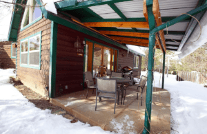 deck with outdoor seating and grill