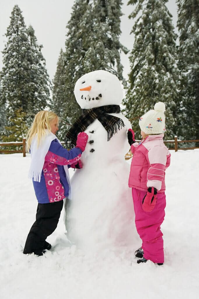 Kids making a snowman