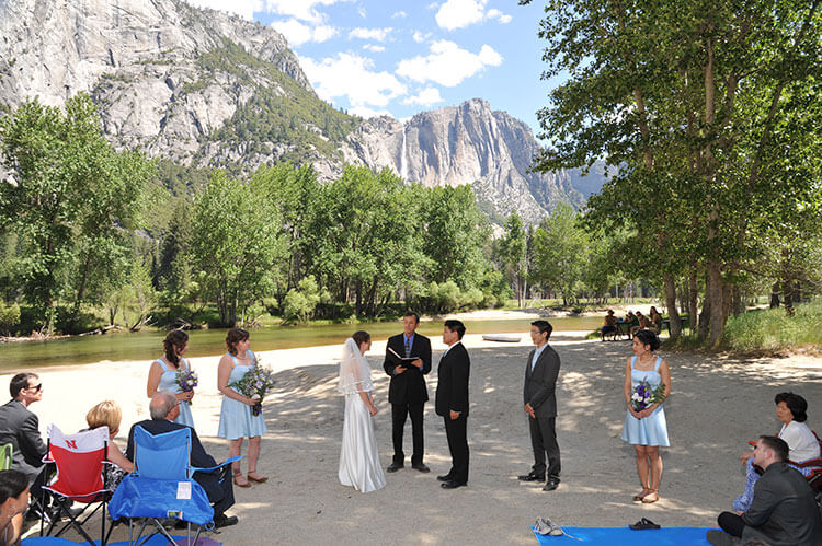 Yosemite wedding ceremony by the Merced River.