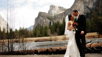 Bride and Groom at Valley View with Bridalveil Fall in the background.