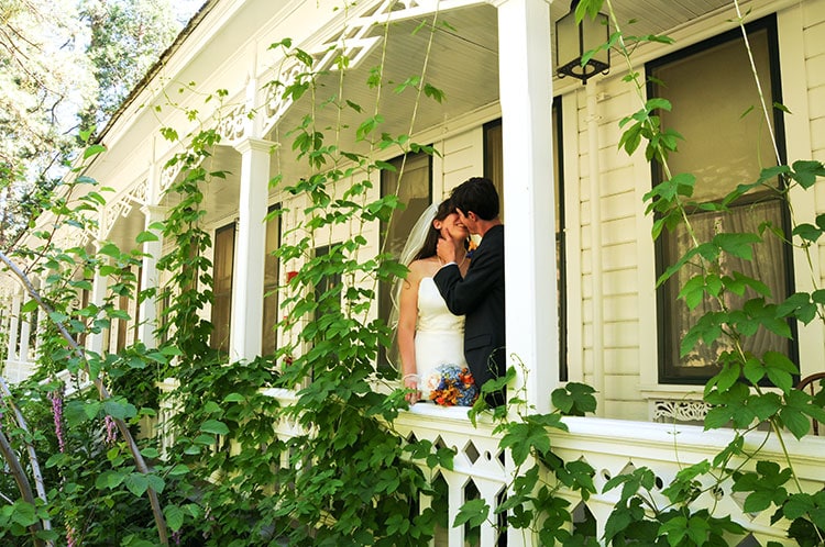 bride and groom kiss at wawona hotel