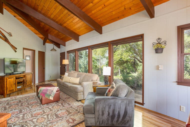 living room with beamed ceilings and seating