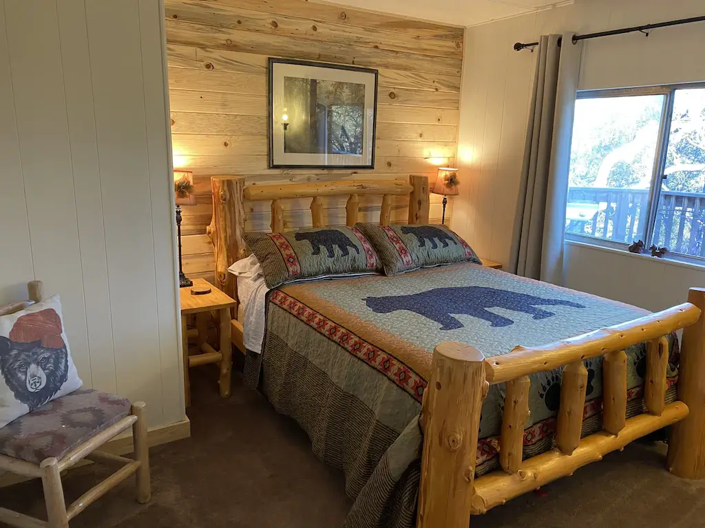 bedroom with wood log bed frame