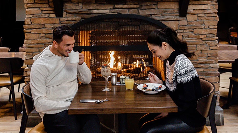 A couple enjoying dinner at Jackalopes Bar and Grill at Tenaya at Yosemite