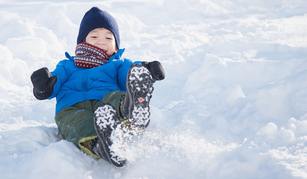 Child playing in the snow