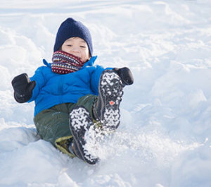 Child playing in the snow