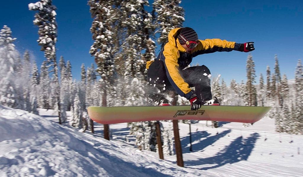Snowboarder catching some air at Badger Pass Ski and Snowboard Area.