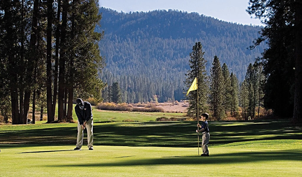 Father and son golfing at Wawona Golf Course