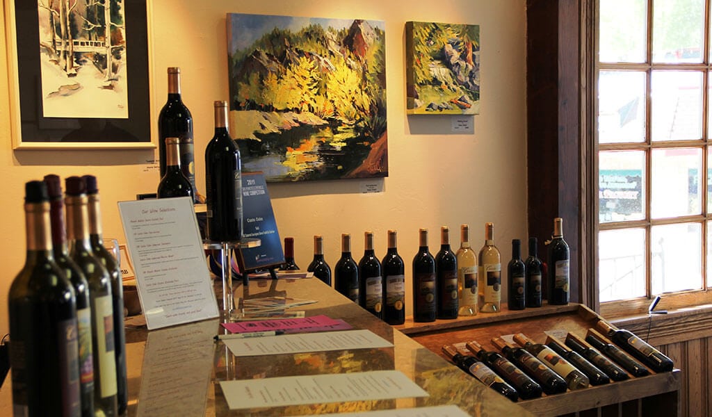 casto oaks tasting room with wine and fine art
