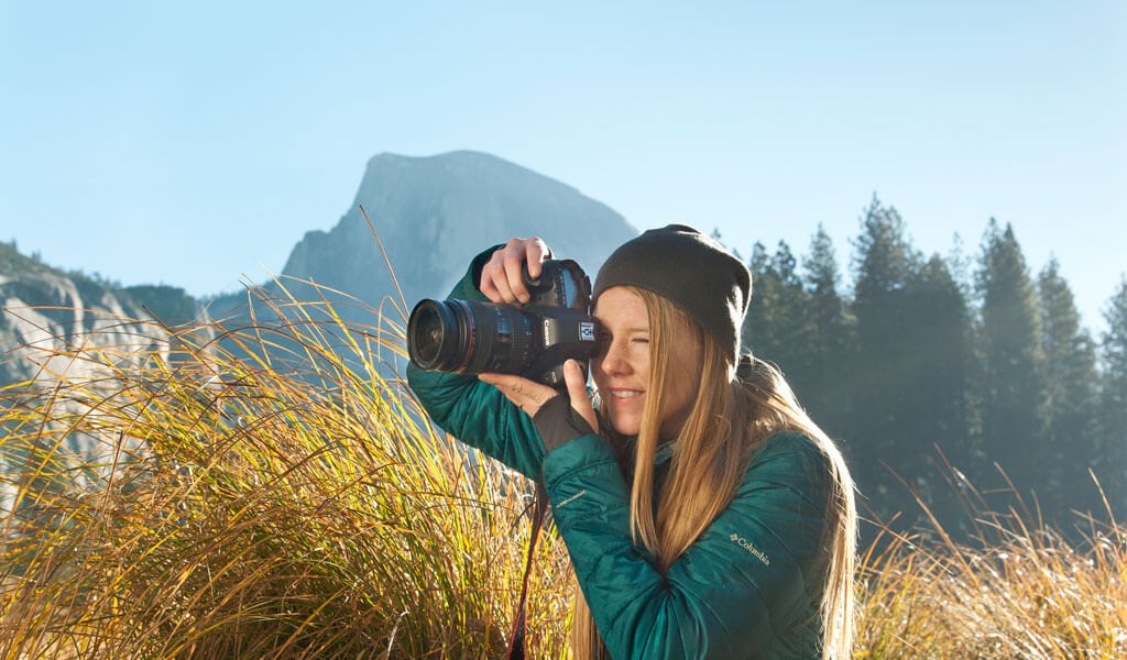 Woman taking a picture in Yosemite Valley