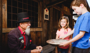 Kids learning to pan for gold