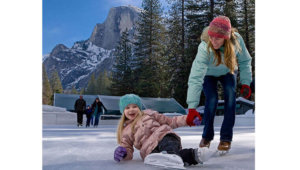 Mother and daughter ice skating at Curry Village Ice Skating Rink.