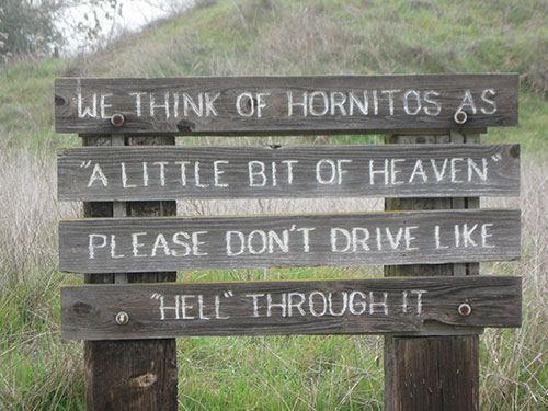 Sign welcoming you to stop in Hornitos