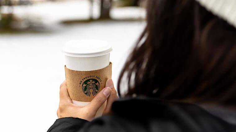 Enjoying a hot Starbucks drink from Parkside Deli while enjoying winter at Tenaya at Yosemite