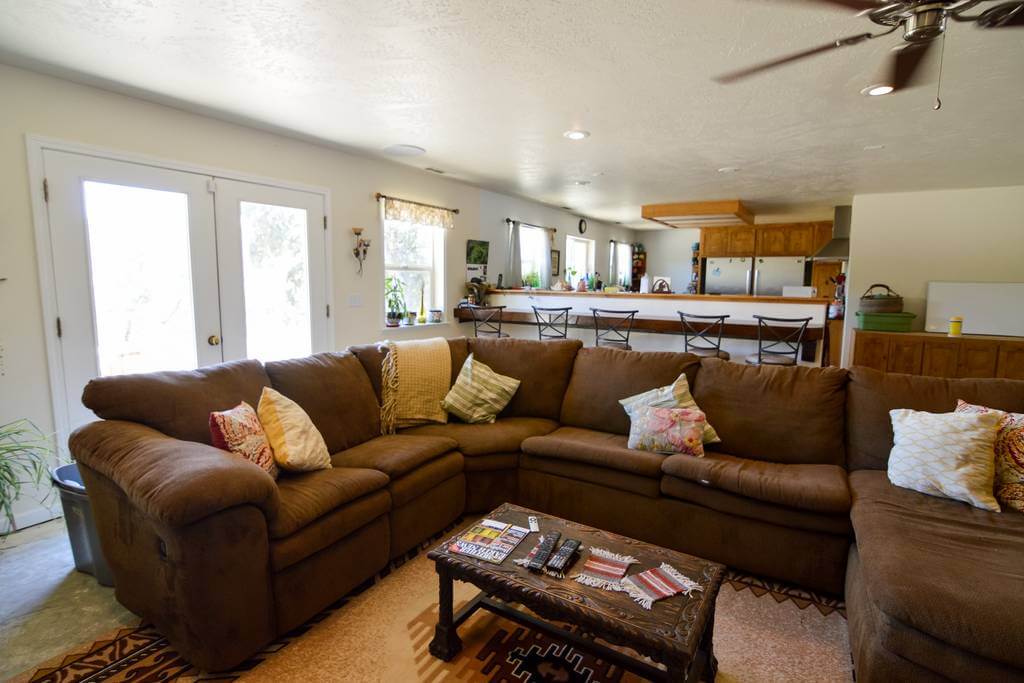 living area with couches and television