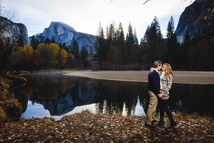 Couple by the Merced River with Half Dome behind