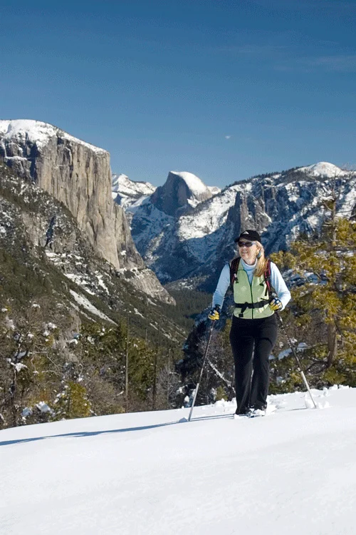 Woman snowshowing in Yosemite during the Winter