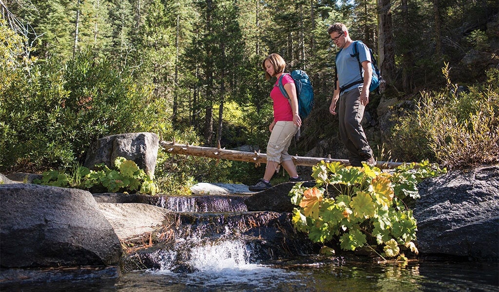 Couple hiking at Jackson Hole near Tenaya Lodge at Yosemite