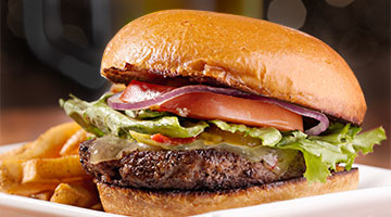 Hamburger with lettuce and tomato and fries