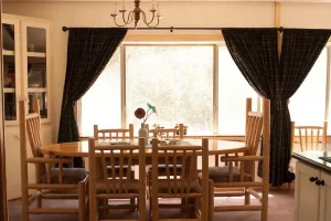 dining room with curtains and dining table
