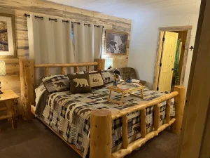 bedroom with wooden log bed frame