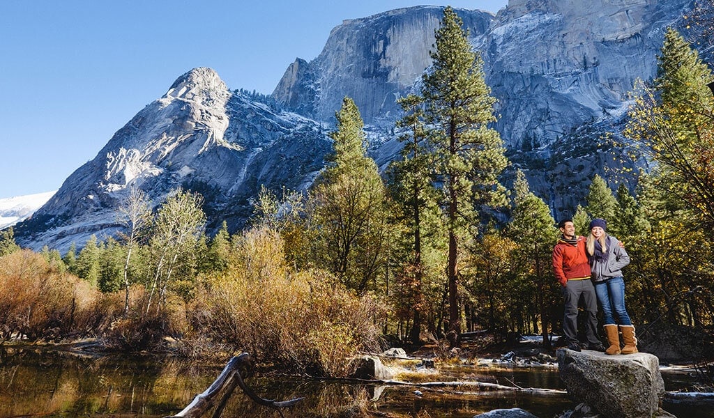 couple below half dome at mirror lake