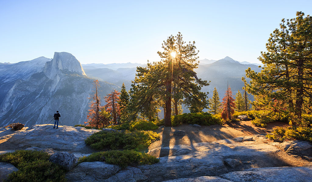 Person at Glacier Point during sunrise