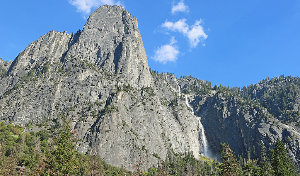 Sentinel Rock with Sentinel Fall flowing beside it