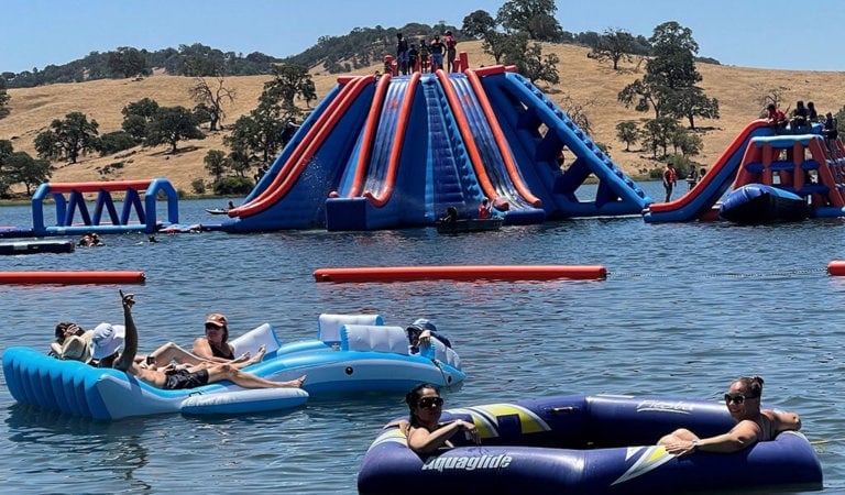 Inflatable action towers and obstacle courses at the Splash N Dash water park.