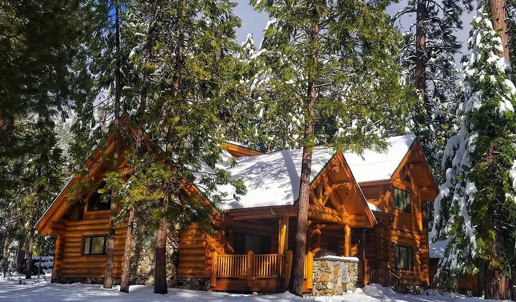 Snowy cabin managed by the Redwoods In Yosemite