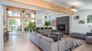 living room with sectional couch and fireplace