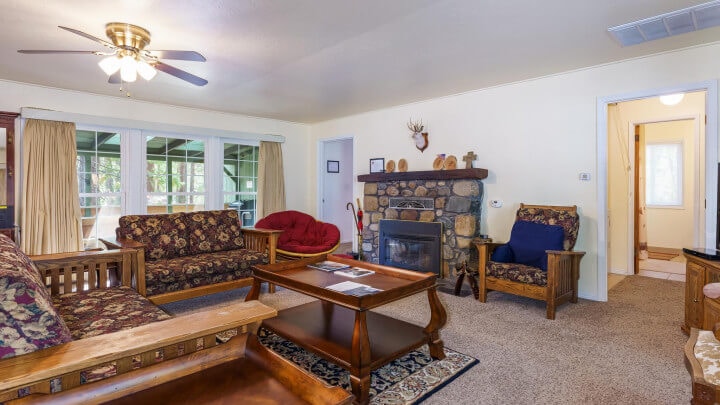 stone fireplace and couches