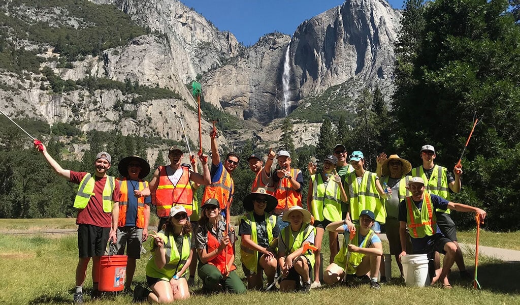 A group of volunteers pose after picking up trash in Yosemite Valley