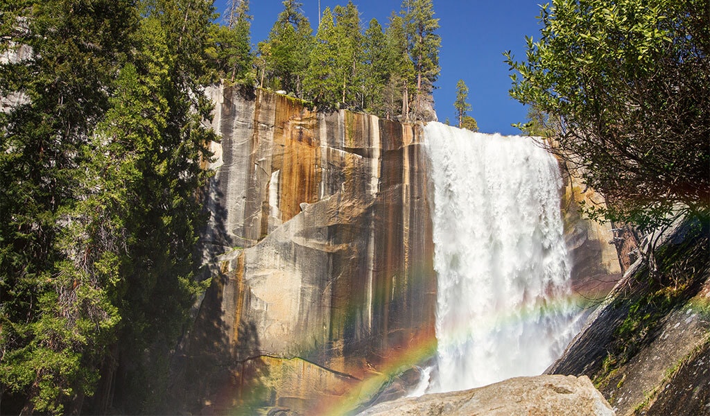 Vernal Fall in spring with a rainbow.
