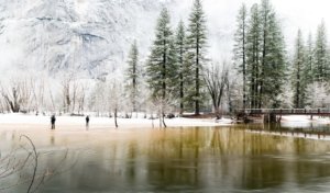 yosemite in winter with snow and frozen lake