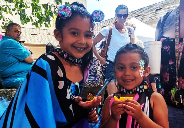 two girls enjoying the butterfly festival