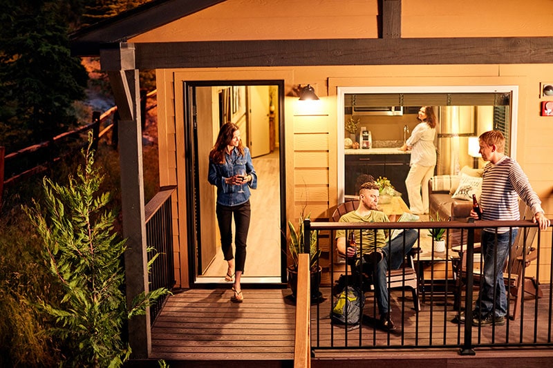 People on the deck at a Yosemite cabin