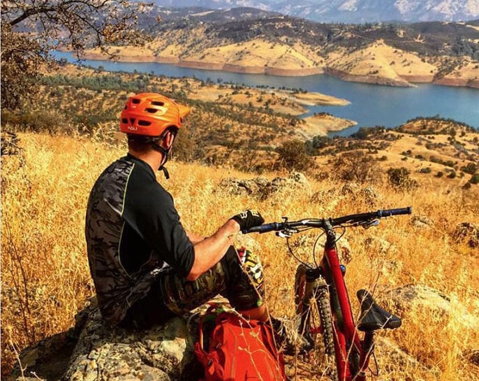 Mountain biker enjoying a view of Lake McClure
