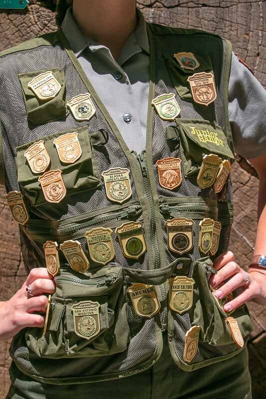 Junior Ranger badges on a vest