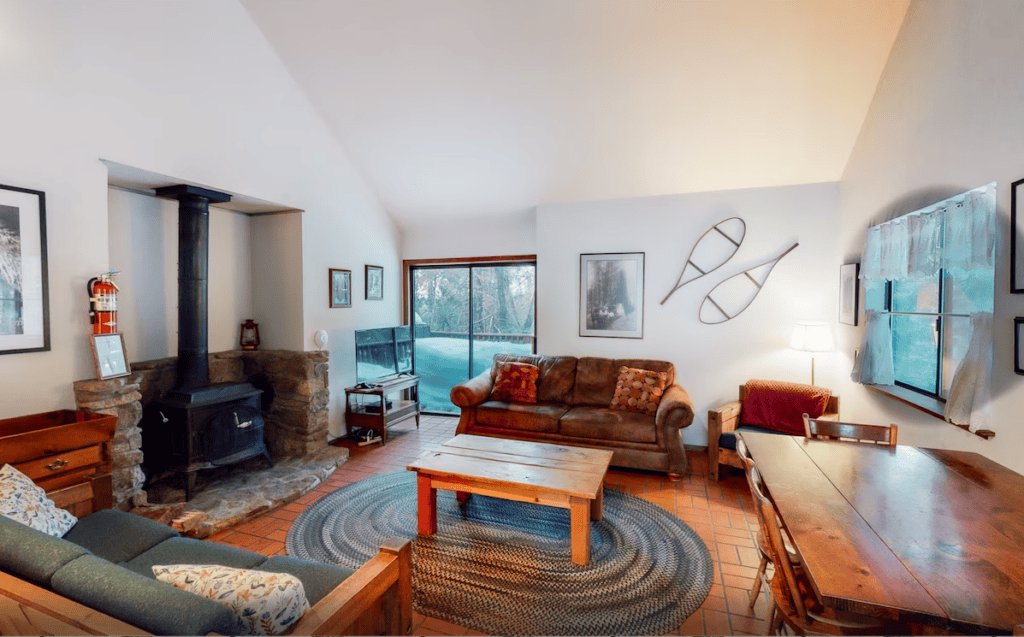 living area with wood stove and seating